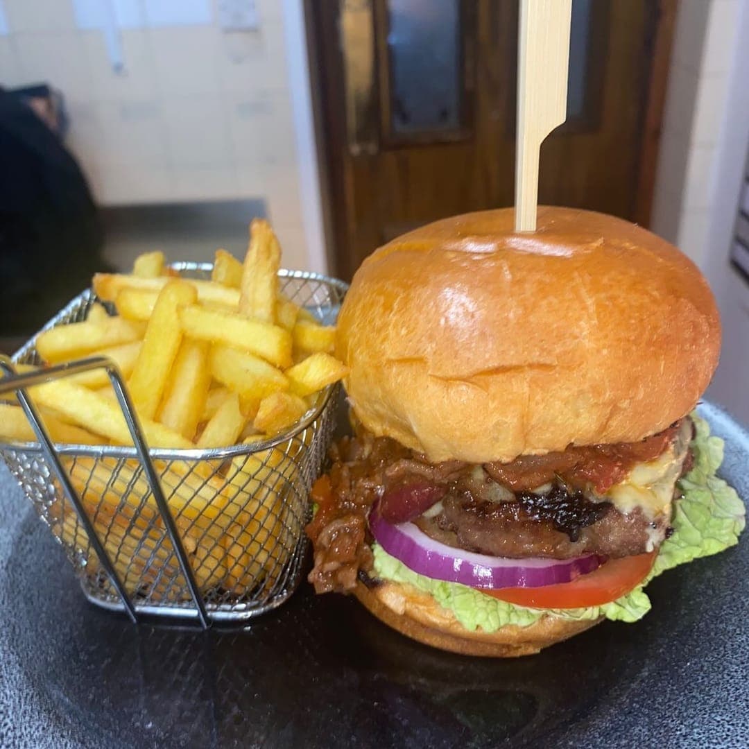 Vesper Gate — loaded burger with fries in a wire basket