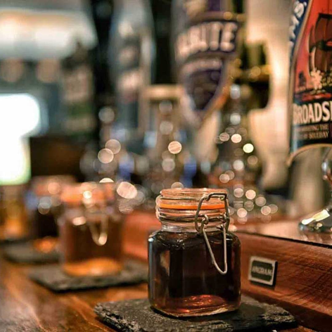 Vesper Gate — ale pumps and a glass on the bar counter