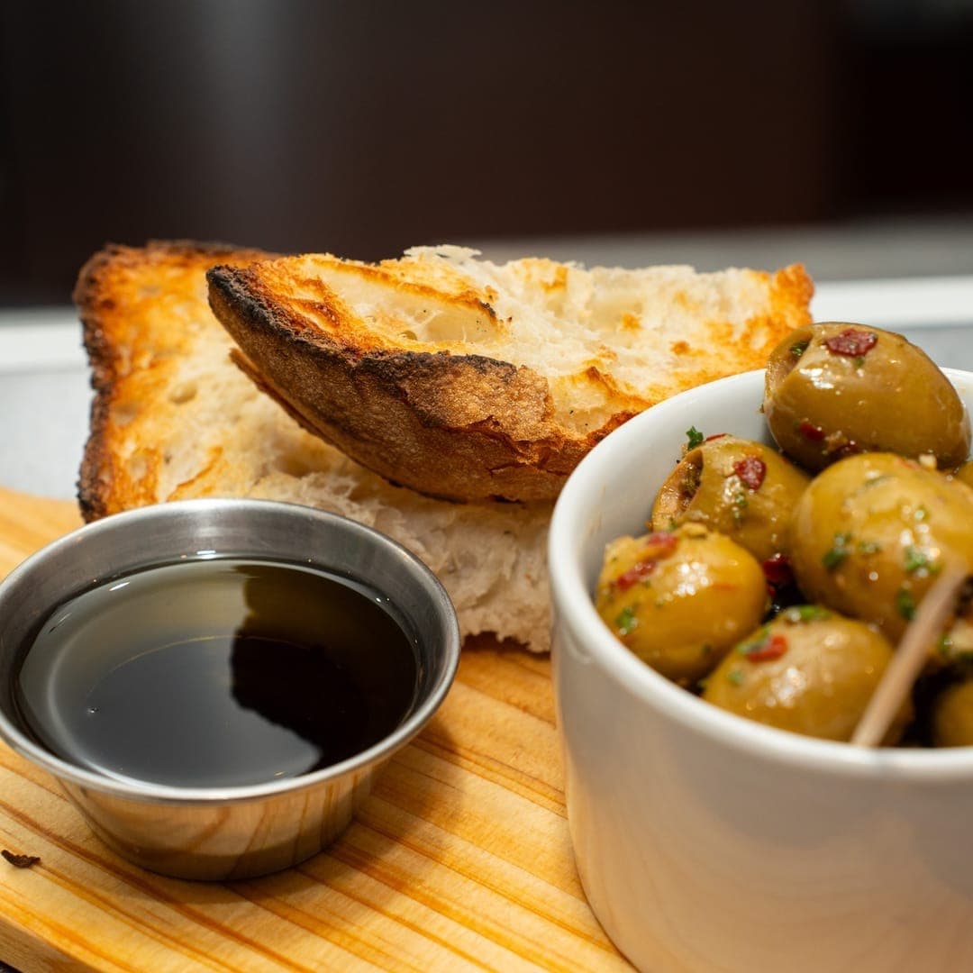 VESUVIUS — focaccia bread with olives and dipping sauce
