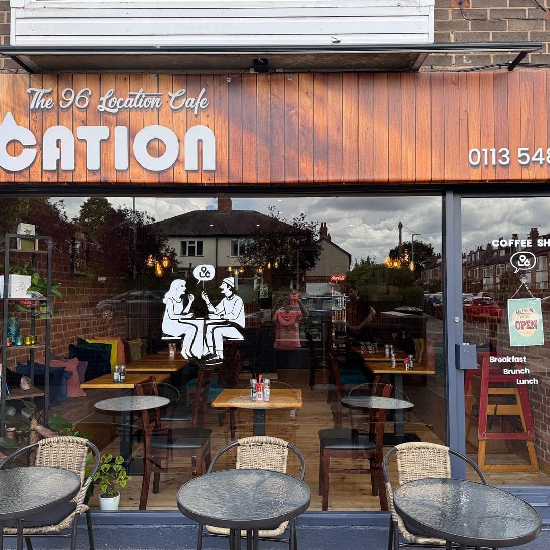 96 location Cafe — exterior frontage with outdoor seating