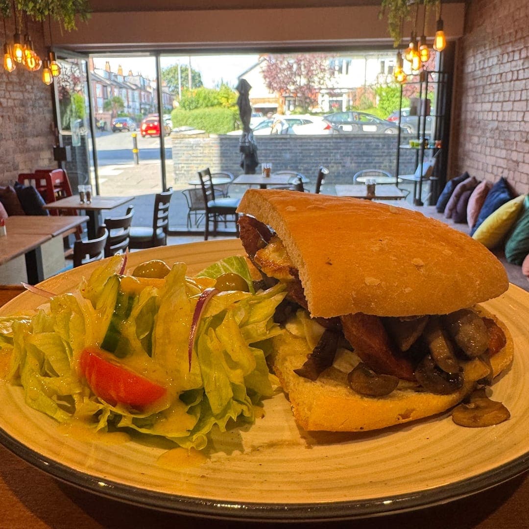 96 location Cafe — filled baguette with salad