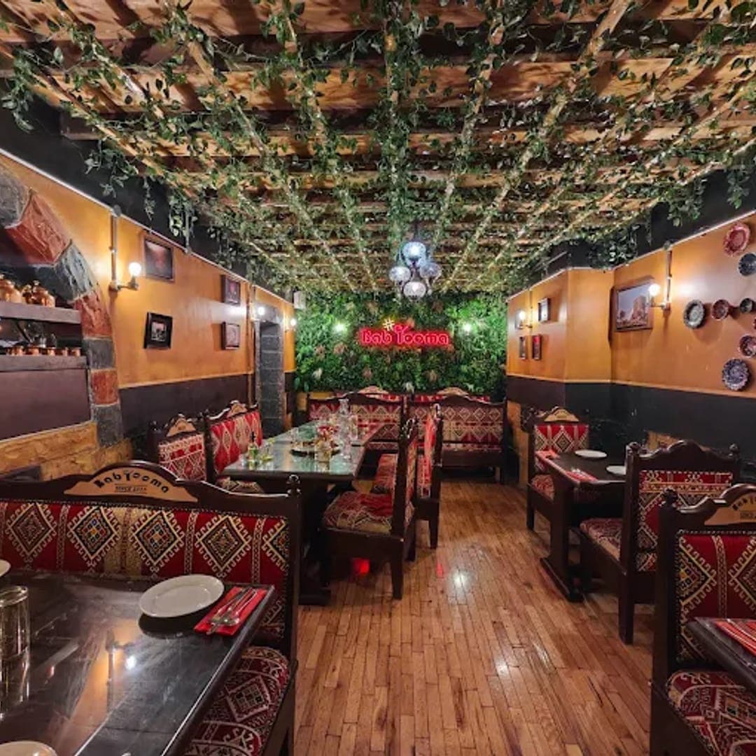 Bab Tooma Leeds — dining room interior with vine ceiling and traditional Syrian decor