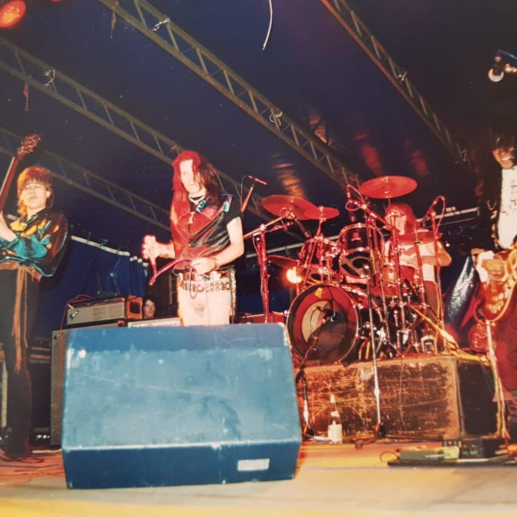 Bat Wings mural by Johnny Cosmic at Kirkgate Market, Leeds — bat wings framing names of Leeds gothic and alternative bands
