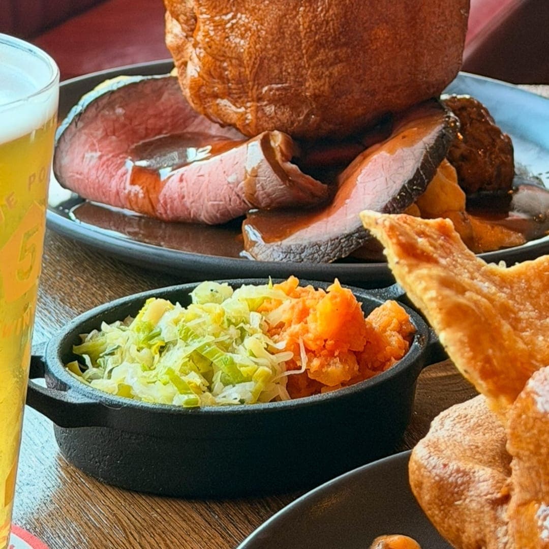 Roast dinner plate at Brewery Wharf Tavern with carved meat, roast potatoes, vegetables and a Yorkshire pudding