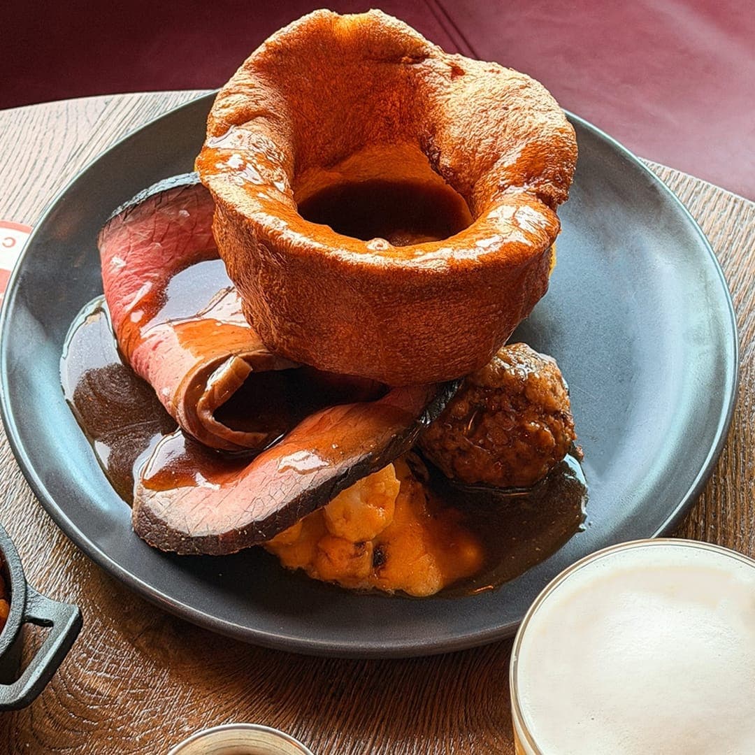 Scotch egg and fondue sharing dish at Brewery Wharf Tavern with warm dipping sauce and garnishes