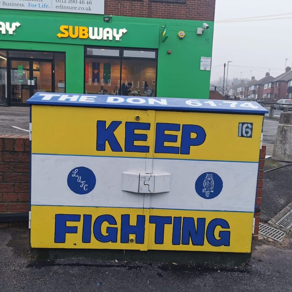 Burley Banksy painted box near Subway in Holbeck, Leeds — "THE DON 61-74 / KEEP FIGHTING" tribute to Don Revie's manager era
