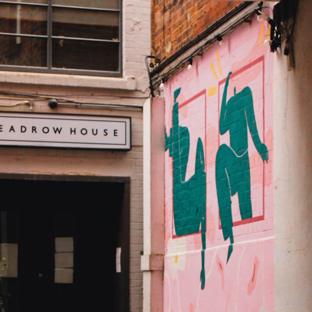 Headrow House Wall mural by Jack Of All Studio in Leeds — illustrated dancing figures with elongated limbs and pea-shaped heads