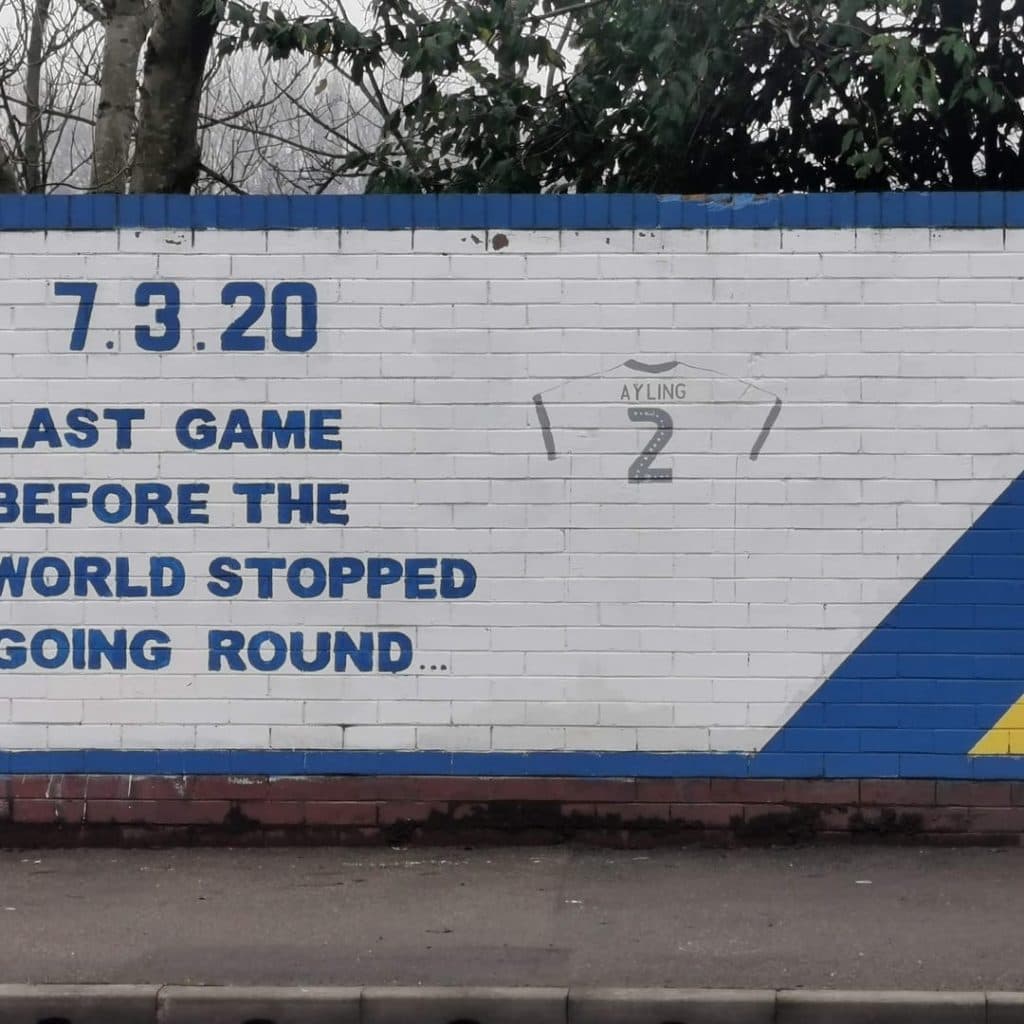 Companion text panel reading "7.3.20 — Last game before the world stopped going round" with Ayling's number 2 jersey