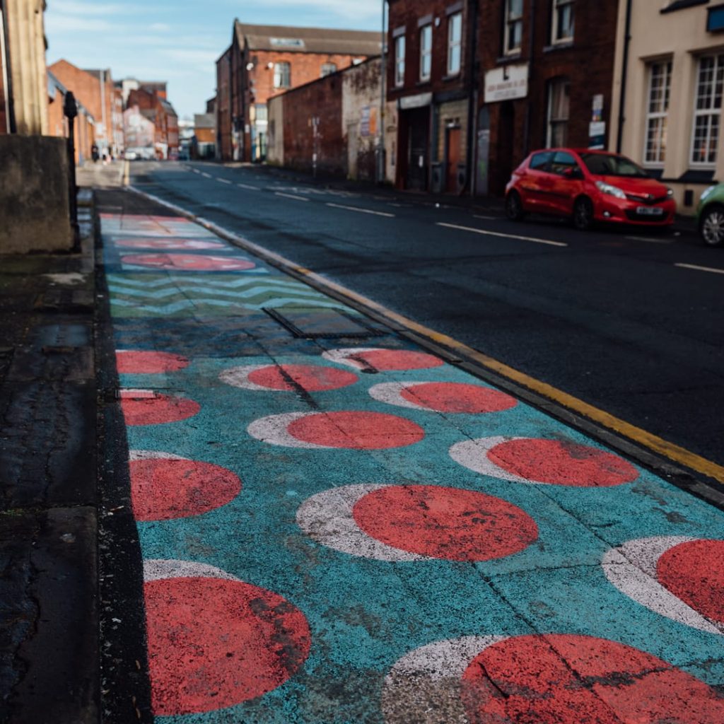 Paving the Way pavement piece by EV / Emma Hardaker on Mabgate, Leeds — geometric outdoor floor mural designed with MAP Charity students