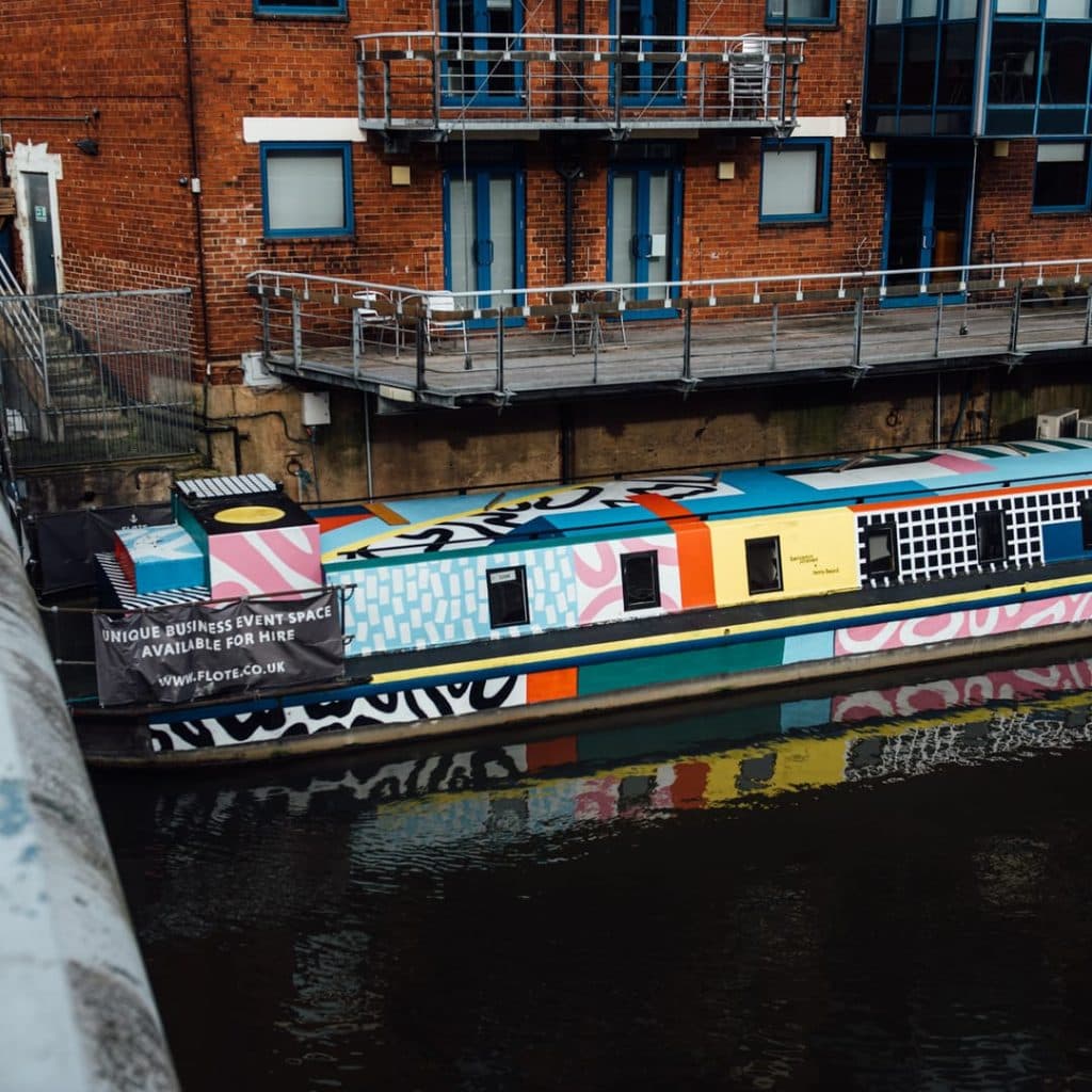 The Grey Heron mural by Peter Barber on the River Aire bank, Wharf Street, Leeds — designed to submerge as the water rises
