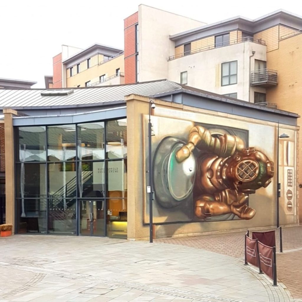 Washing Marine mural at Brewery Wharf, Leeds — wide street view showing the anamorphic 3D effect