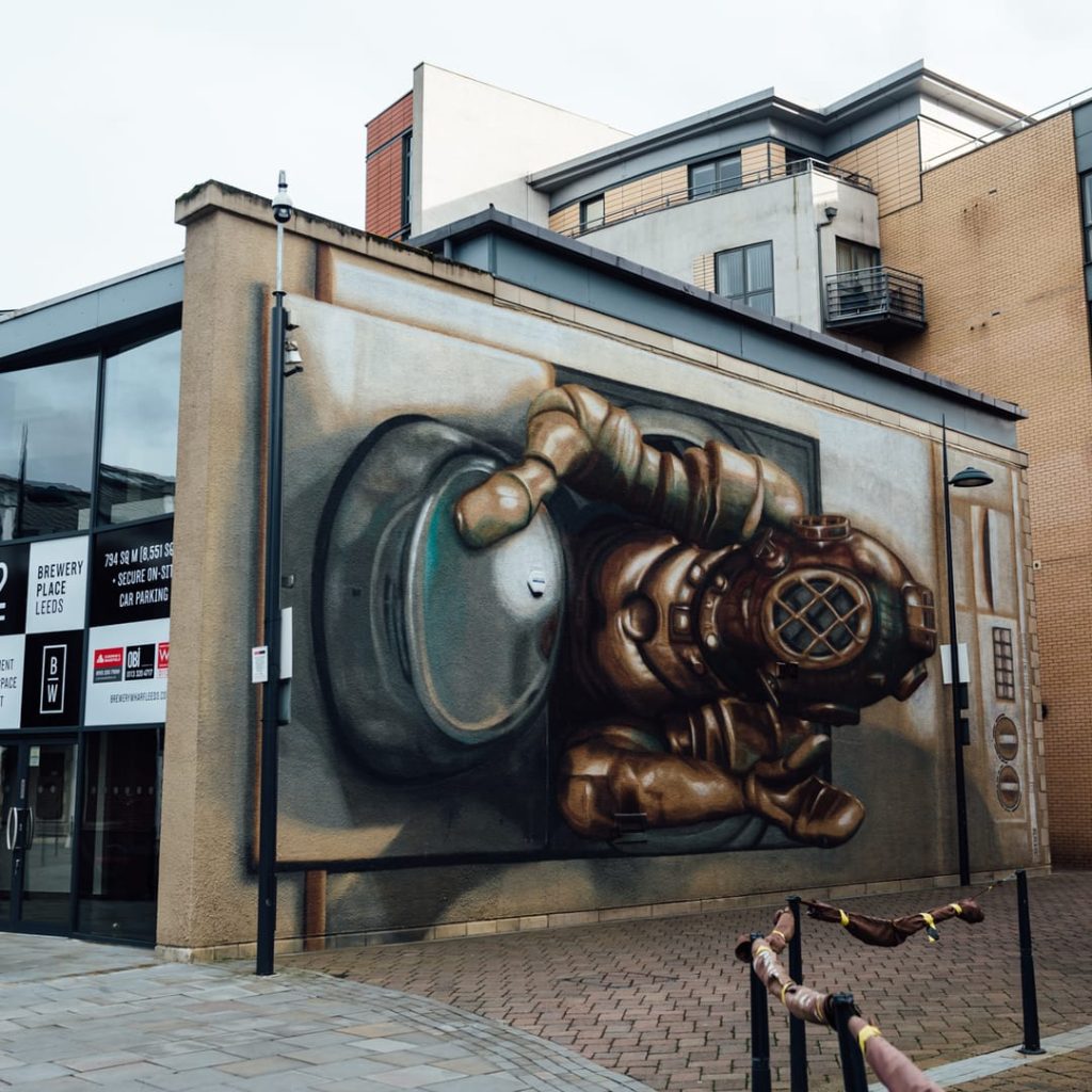 Washing Marine 3D mural by Replete at Brewery Wharf, Leeds — vintage deep-sea diver climbing from a washing machine