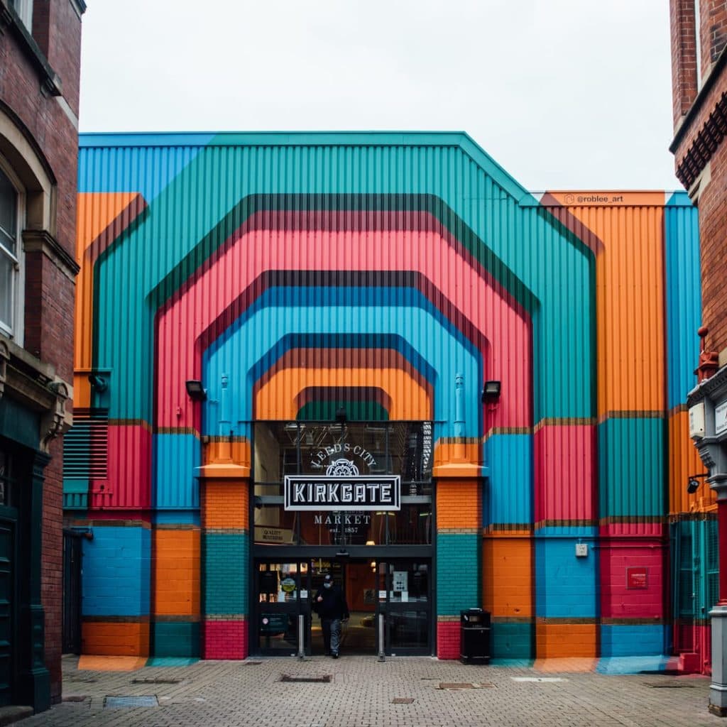 #Welcome mural by Rob Lee at the New York Street entrance to Kirkgate Market, Leeds — 3D geometric panels in Victorian-inspired pattern