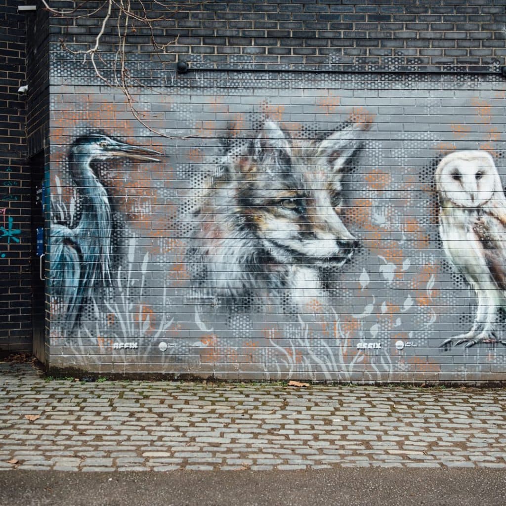 Wildlife mural by Affix on Armouries Drive, Leeds — fox, heron and owl celebrating the urban canal-side ecosystem