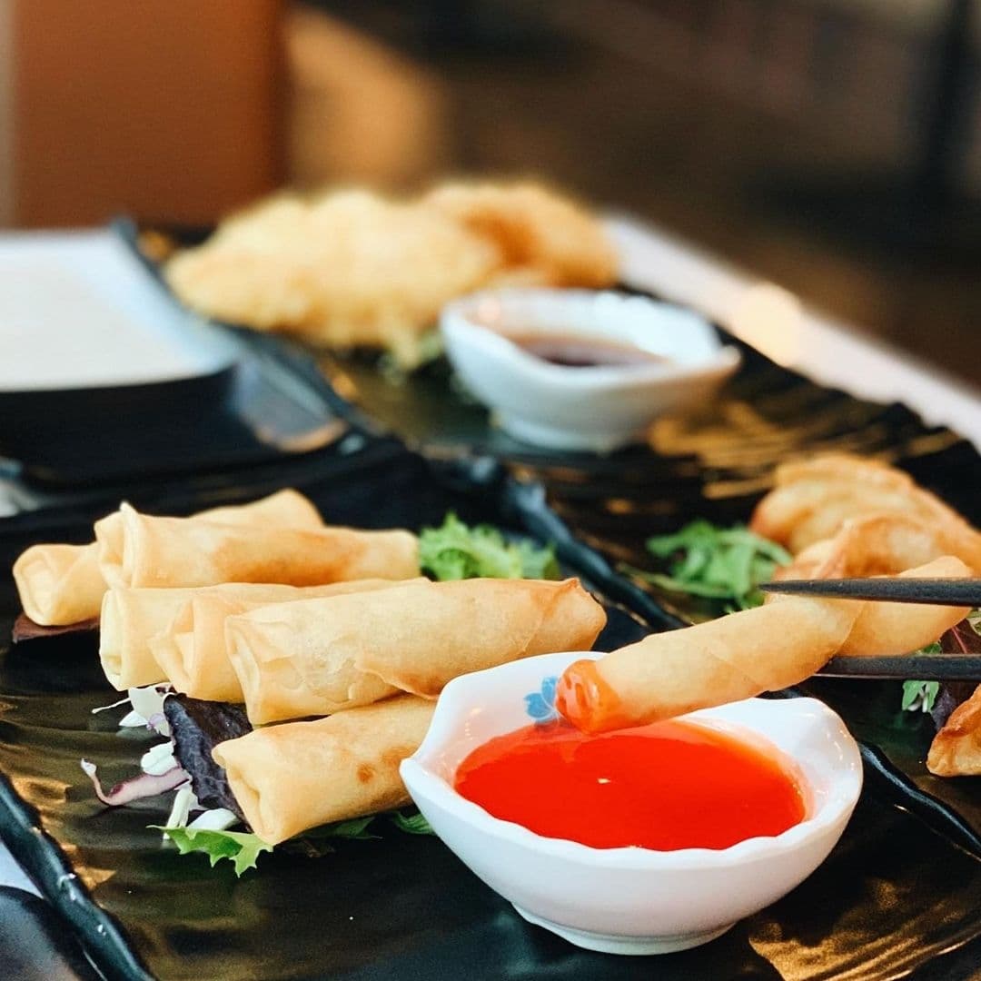 Blue_Sakura_Asian_Cuisine_Spring_Rolls_Dipping_Sauce Assorted appetizers including spring rolls with sweet chili sauce at Blue Sakura.