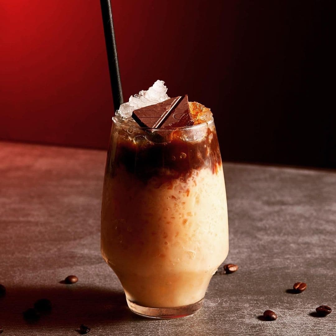 Jakes Bar Still Room Crafted Coffee Cocktail Chocolate Garnish Iced coffee cocktail with a chocolate garnish at Jake's Bar & Still Room.