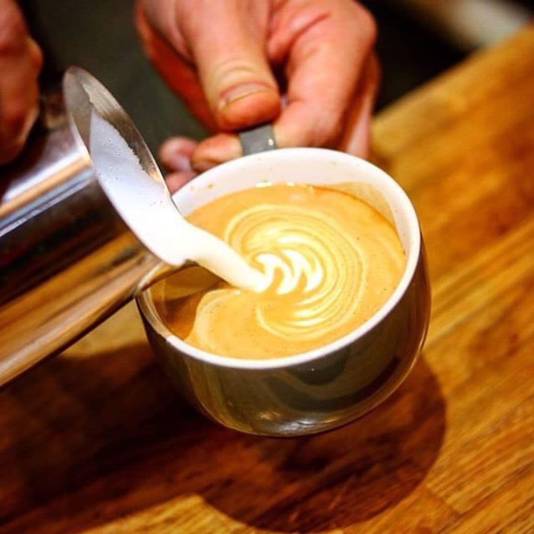 Kapow Coffee Thorntons Arcade Barista Latte Art Craftsmanship Barista creating latte art at Kapow Coffee – Thorntons Arcade.