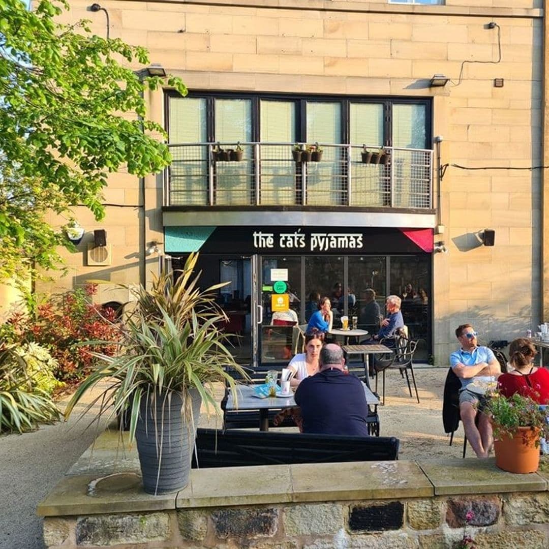 The Cats Pyjamas Chapel Allerton Outdoor Dining Sunny Evening Outdoor seating at The Cat’s Pyjamas – Chapel Allerton with patrons enjoying meals in the sunshine.