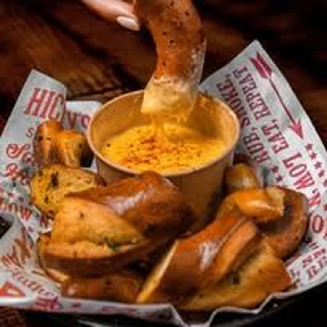 Fazenda Bar Grill pretzel dipping cheese appetizer food Delicious pretzel bites served with warm cheese dip at Fazenda Bar & Grill.