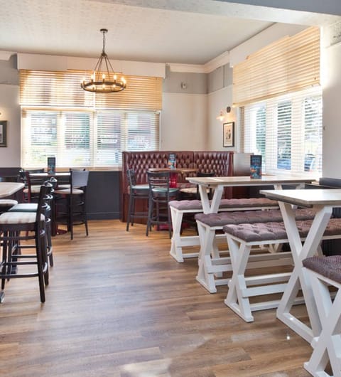 card-1772726651720 Royal Park Cellars bar area with branded logo on wall at The Royal Park Leeds