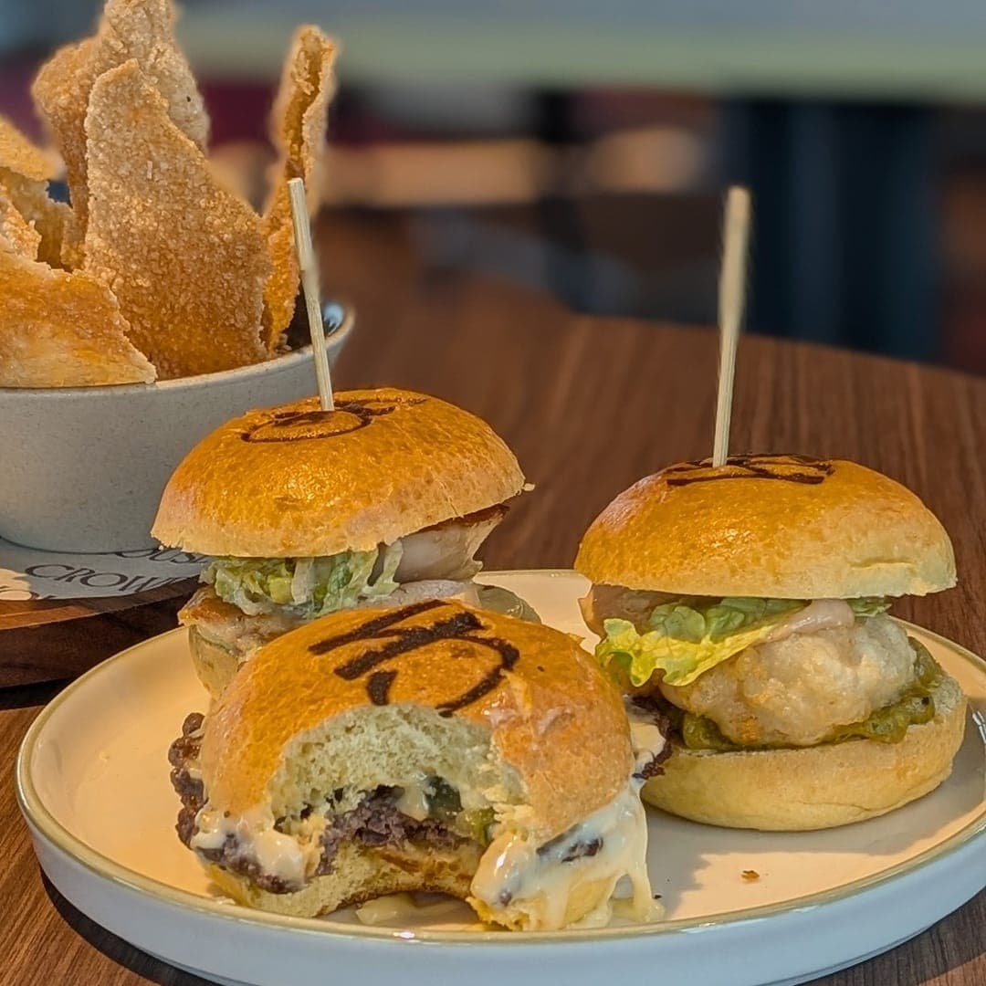 gallery-1772619297273 Rooftop sliders with chicken caesar, tempura prawn and smashed patty at CrowdedHouse Leeds